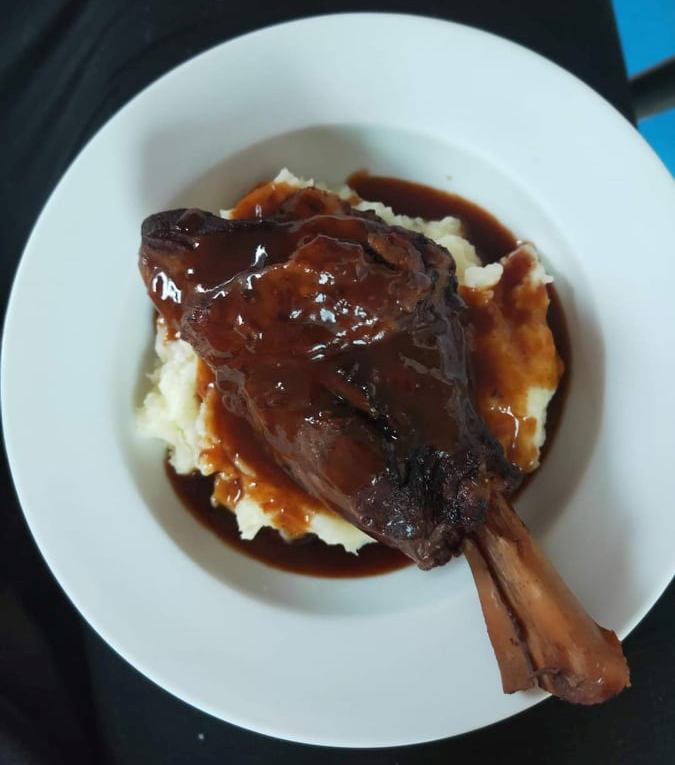 Slow Cooked Lamb Shanks In Red Wine Sauce On Mash Potato