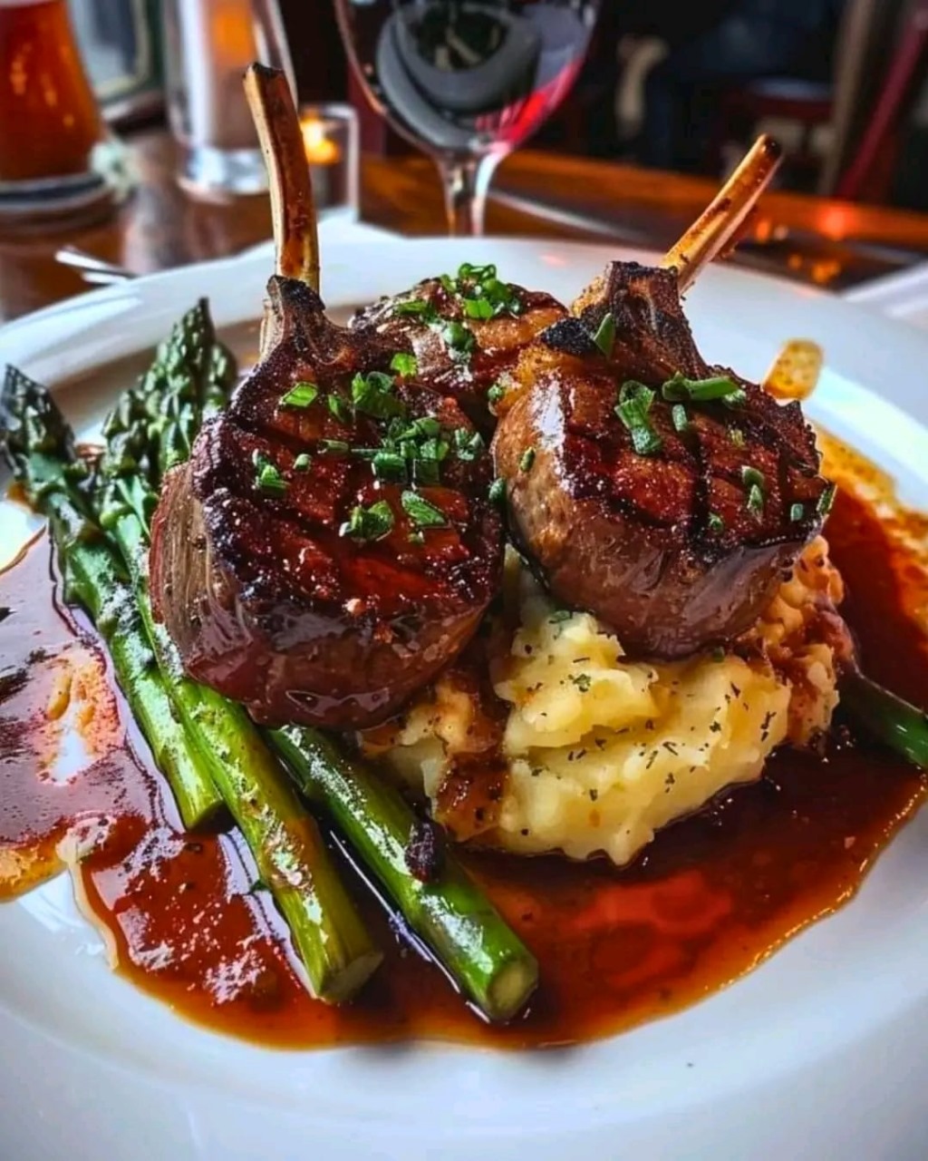 Succulent Lamb Chops Over Lobster Mashed Potatoes with Asparagus: A Gourmet Feast